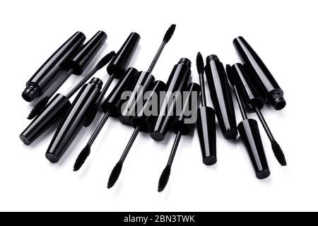 Mascara brushes and containers on white background Stock Photo