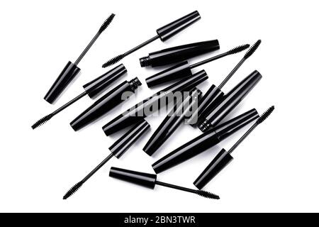 Mascara brushes and containers on white background Stock Photo