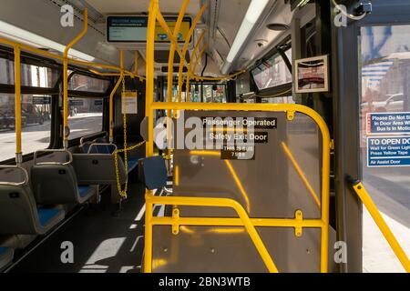 An empty M20 bus in New York on Saturday May 2, 2020. Since the lockdown bus ridership has declined 80% and subway ridership dropped 90%. (© Richard B. Levine) Stock Photo