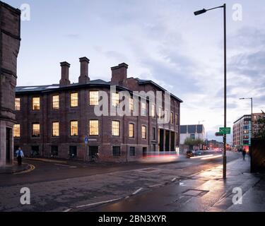 Exterior street view at dusk. Edinburgh Printmakers, Edinburgh, United Kingdom. Architect: Page  Park Architects, 2019. Stock Photo