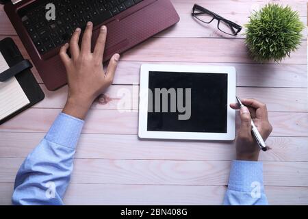 high angle view of man working on office desk  Stock Photo