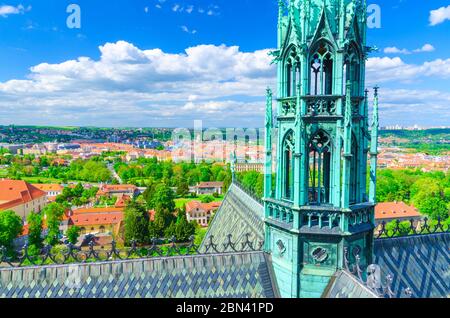 Top aerial view of Prague Royal Garden and roof and spire of St. Vitus cathedral, blue sky white clouds background, Bohemia, Czech Republic Stock Photo