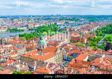 Top aerial panoramic view of Prague historical city centre with red tiled roof buildings in Mala Strana Lesser Town and Smichov districts, bridges over Vltava river, Bohemia, Czech Republic Stock Photo