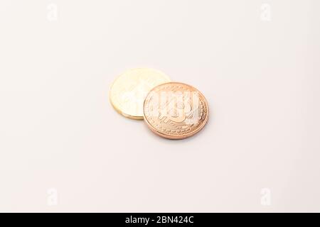Golden Bitcoins isolated on white background, new virtual money Stock Photo