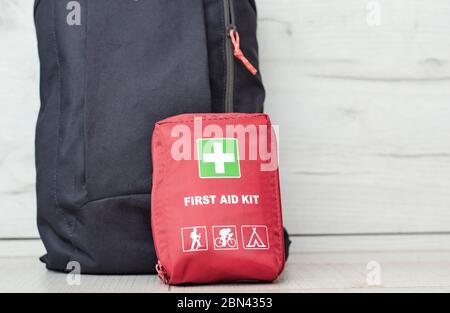 Close up view with a backpack along with a first aid kit ready for the mountain trip . Stock Photo