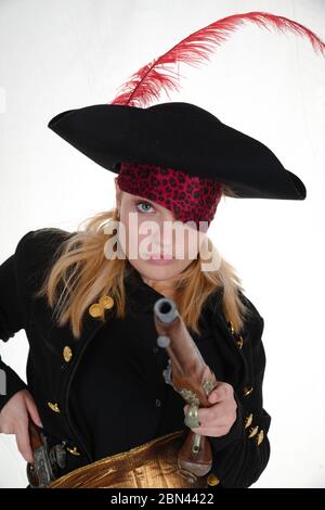 carribean girl pirate in the black background look the camera Stock Photo