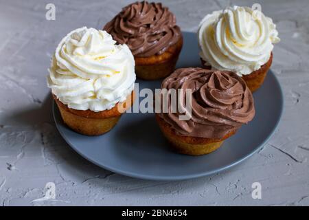 Homemade four cupcakes with caramel syrup and chocolate cream, no gluten meal Stock Photo