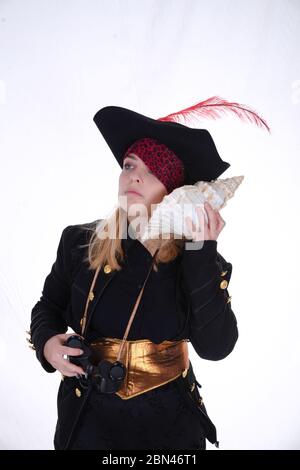 carribean girl pirate in the black background look the camera Stock Photo