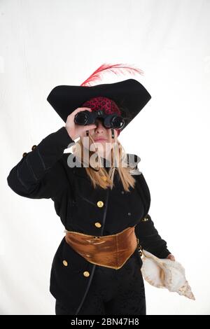 carribean girl pirate in the black background look the camera Stock Photo