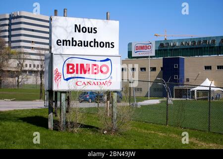 'We hire' sign outside the Bimbo Canada Bread factory in east end of Montreal Stock Photo