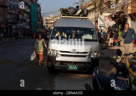 Kathmandu, Nepal - November 13, 2016: A car with backpacks on the roof stands on the Buddha road in Kathmandu. A car for transporting tourists in Nepa Stock Photo
