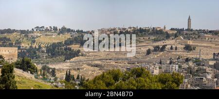 Jerusalem, Israel - May 5th, 2020: Silwan villge and Mount of Olives towering above it. Among the sites seen: the russian church of the ascention, the Stock Photo