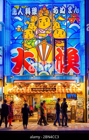 Naha, Okinawa / Japan - February 26, 2018: Colorful neon storefront of a popular seafood restaurant in Okinawa, Japan Stock Photo