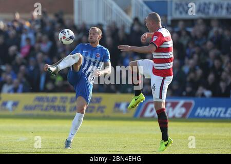 HARTLEPOOL, ENGLAND - Lewis Alessandra of Hartlepool United and Luke McCullough of Doncaster Rovers during the SKY Bet League 2 match between Hartlepool United and Doncaster Rovers at Victoria Park, Hartlepool on Saturday 6th May 2017 (Credit: Mark Fletcher | MI News) Stock Photo