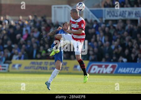 HARTLEPOOL, ENGLAND - Lewis Alessandra of Hartlepool United and Luke McCullough of Doncaster Rovers during the SKY Bet League 2 match between Hartlepool United and Doncaster Rovers at Victoria Park, Hartlepool on Saturday 6th May 2017 (Credit: Mark Fletcher | MI News) Stock Photo