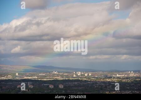 Glasgow, Scotland, UK. 12th May, 2020. Pictured: Looking North over Glasgow with the Campsie Fells in the background surrounded by a veil of rain and dark clouds with a cloud base of around 2,500ft. Cool evening temperatures as a blast of arctic air mass descends from the north with stead rain and strong but brief spells of sunshine through gaps in the cloud. Credit: Colin Fisher/Alamy Live News Stock Photo