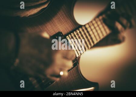 Close Up Of Male Musical Performer Playing On Brown Electric Guitar. Stock Photo