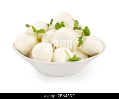Mozzarella balls with micro greens, basil leaves in white bowl isolated on white background. Stock Photo