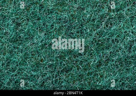 The texture of the abrasive side of a dishwashing sponge, close-up Stock Photo