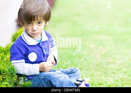 Happy Child Eating Delicious Food Outdoors Stock Photo