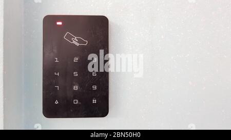 Electronic lock on the wall with copy space. Digital security systems for door security. Selective focus Stock Photo