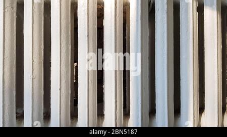 Old white cast-iron heating radiator in grunge style close-up Stock Photo