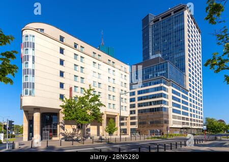 Warsaw, Mazovia / Poland - 2020/05/10: North Gate office tower building at 17 Bonifraterska street in Srodmiescie district of Warsaw, with Ibis Warsza Stock Photo