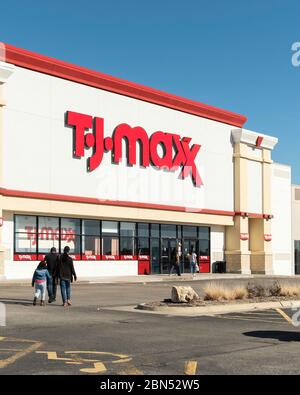 The storefront with customers entering the TJ Maxx department store in