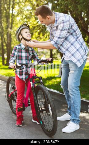 Little girl is getting ready for a first ride Stock Photo