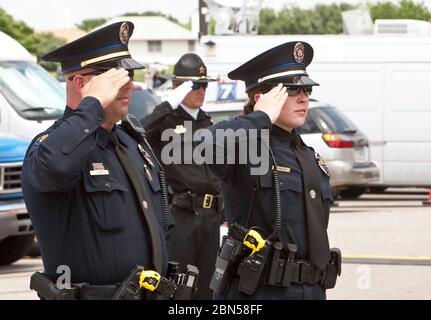 Austin Texas USA, April 11 2012: Uniformed police officers pay tribune at funeral of Austin Police Department officer Jaime Padron, who was killed in the line of duty.  ©Marjorie Kamys Cotera/Daemmrich Photography Stock Photo