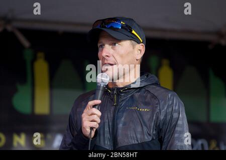 Austin Texas USA, February 19, 2012: Cyclist Lance Armstrong encourages the crowd as more than 18,000 runners waited at the starting line for the 22nd annual Austin Marathon. ©Bob Daemmrich Stock Photo