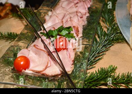 Romanian traditional Christmas food buffet with sorici, caltabos, toba and pork meat cuts, ham, platters with variety of dishes. Fresh Food Buffet Bru Stock Photo