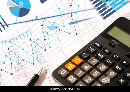 businessman work in office analysis chart graphy planning analyzing financial document data charts using calculator strategy analysis financial Stock Photo