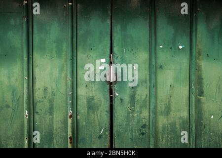 Old rusty metal green door texture background Stock Photo