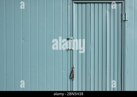 Blue painted metal door and wall. modern architecture Stock Photo