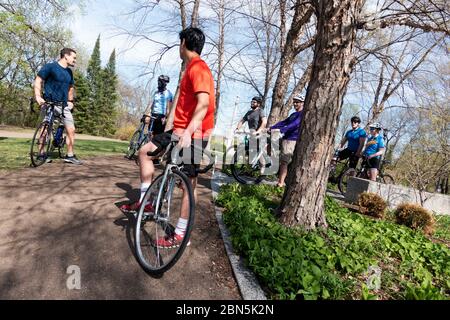 Bikers keeping social distance, but still socializing during coronavirus covid-19 pandemic St Paul Minnesota MN USA Stock Photo