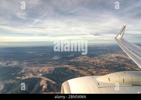 Ryanair flying and traveling, view from airplane window on the wing. Stock Photo
