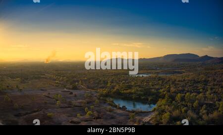 This unique photo shows the hilly landscape with lakes, from hua hin thailand, taken with a drone during a fantastic sunset! Stock Photo