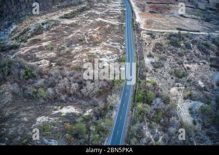 This unique photo shows the rustic autumn landscape of Hua Hin. A country road leads through this scenario. The picture is a drone photo! Stock Photo