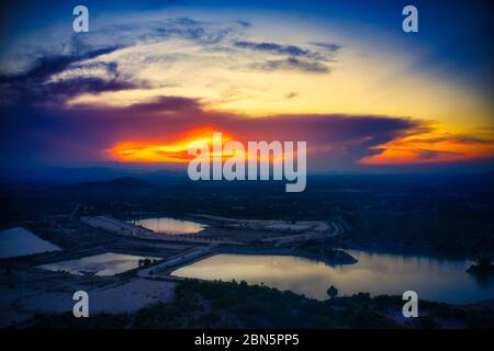 This unique photo shows the hilly landscape with lakes, from hua Hin in thailand, taken with a drone during a fantastic sunset! Stock Photo