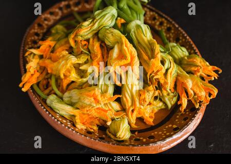 fresh squash blossoms, flor de calabaza, freshly harvested in mexico Stock Photo