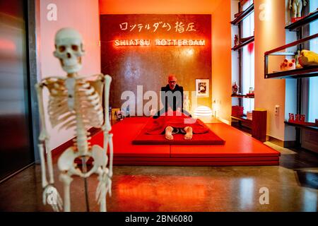 Rotterdam, Netherlands. 13th May, 2020. louis Casteelen in action doing the Shiatsu, a Japanese form of massage in which the therapist presses different points of the body to find disturbances in the muscles, nerves and organs. Credit: SOPA Images Limited/Alamy Live News Stock Photo