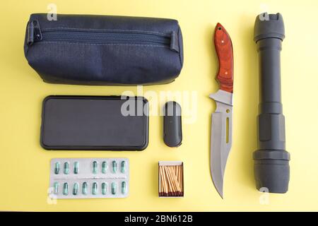 Emergency kit on yellow background Stock Photo