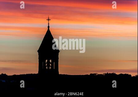 Timoleague, West Cork, Ireland. 13th May, 2020. The sun rises over the Church of the Nativity of the Blessed Virgin Mary in Timoleague this morning. Credit: AG News/Alamy Live News