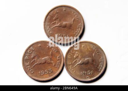 Indian Old vintage coins. Old Indian One Pice Coin of 1951 and 1953 isolated on white background. Stock Photo