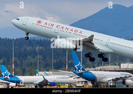 Richmond, British Columbia, Canada. 1st May, 2020. An Air Canada Airbus A330-300 jet (C-GHKX) takes off from Vancouver International Airport, Richmond, B.C. on Friday, May 1, 2020. Credit: Bayne Stanley/ZUMA Wire/Alamy Live News Stock Photo