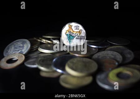Two rupee coin of India isolated on black background. Map of India as a symbol of the Indian national integration depicted in the Indian coins. Stock Photo