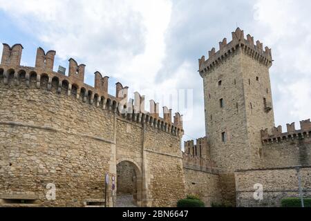 Vigoleno,Italy- July 22, 2018:View of the city walls and the entrance of Vigoleno, one of the most beautiful villages in Italy during a cloudy day. Stock Photo