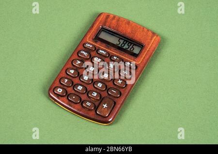 Pocket calculator in a wood effect casing, Spain, Europe. Stock Photo