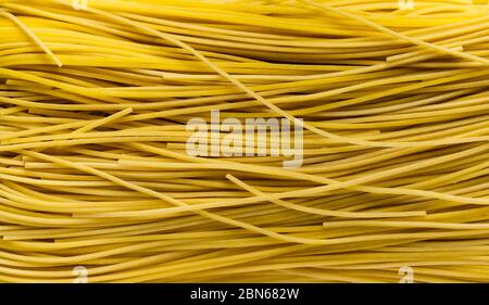 Macro dried yellow rice vermicelli or fill the frame with dried yellow rice vermicelli. Stock Photo